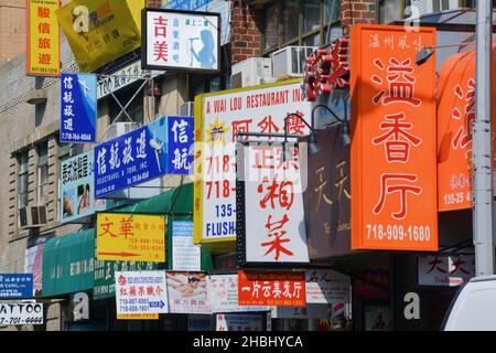 Multitude of street signs on 40th Road in Chinatown, downtown Flushing ...