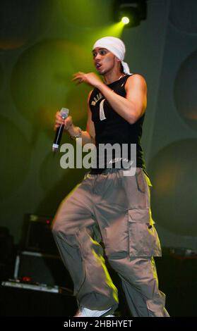 Billy Crawford performs live on stage supporting Liberty X at the Hammersmith Apollo, London. Full Length, bandana, vest top. Stock Photo