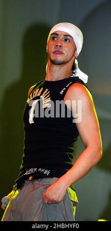 Billy Crawford performs live on stage supporting Liberty X at the Hammersmith Apollo, London. Half Length, bandana, vest top. Stock Photo