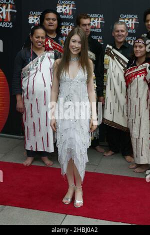 Hayley Westenra Young Classical Opera Singer from New Zealand with Maori welcoming performers at arrivals at the Classical Brit Awards at the Royal Albert Hall, London. Full length. Stock Photo