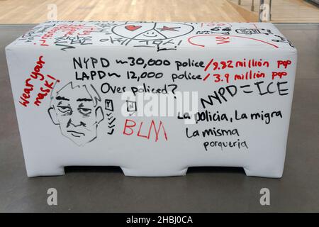 A plywood and foam imitation of an NYPD police barrier that viewers are invited to write on. At the Queens Museum in Flushing Meadows Corona Park, NYC Stock Photo