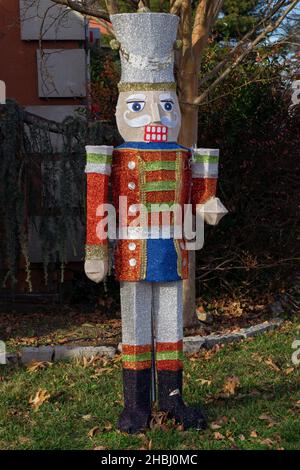 CHRISTMAS TOY SOLDIER.  A yard is decorated with a traditional nutcracker soldier. In Malba, Queens, NYC. Stock Photo