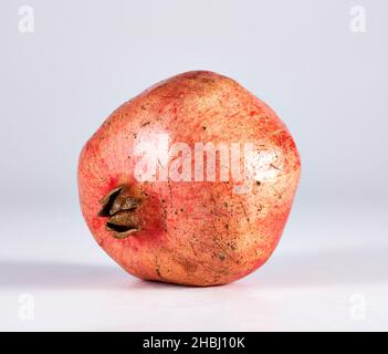Fresh pomegranate fruits and juicy seeds isolated on white background Stock Photo