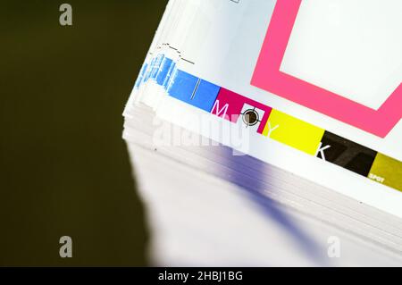 Offset printing. Sheets of printed products. CMYK press. Paper at the ...