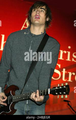 Busted; Charlie Simpson; attend and perform on stage at the annual Regent Street Christmas Lights switching-on ceremony, having performed live, in Regent Street on November 7, 2004 in London. Stock Photo