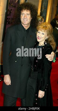 Brian May and Anita Dobson arrive at the final of 'UK Music Hall Of Fame', the Channel 4 series looking at popular music from the 1950's to the 1990's, at the Hackney Empire on November 11, 2004 in London. Stock Photo