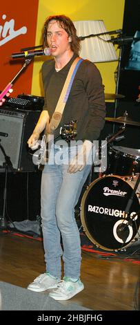 Johnny Borrell of London-based indie-rock band Razorlight play live and sign copies of their latest single 'Rip It Up', released November 29, at Virgin Megastore, Oxford Street on December 2, 2004 in London. Stock Photo
