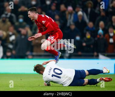 LONDON, England - DECEMBER 19: Tottenham Hotspur's Harry Kane tackles Liverpool's Andrew Robertson during Premier League between Tottenham Hotspur and Stock Photo