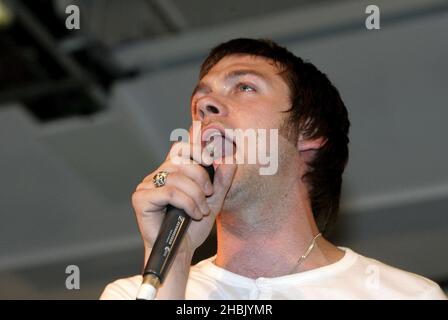 Tom Meihan of Kasabian from Leeds launches new album Empire, and performs at HMV, Oxford Street in London. Stock Photo