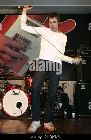 Tom Meihan of Kasabian launches new album Empire, and performs at HMV on Oxford Street, London on August 30, 2006.  Entertainment Stock Photo