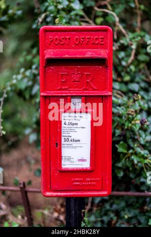 Red Postbox - Red British Letter Box. Red British Post Box - UK Red Post Box - note photograph taken with shallow depth of field Stock Photo