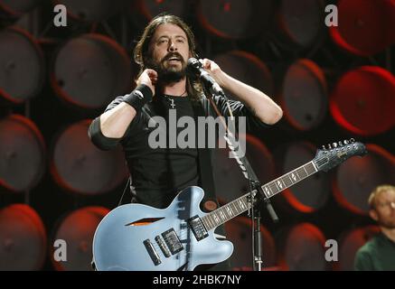 Dave Grohl of the Foo Fighters performs during the charity concert at Wembley Stadium, London. Stock Photo
