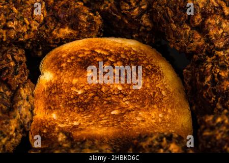 A closeup shot of freshly fried meatballs with toasted bread Stock Photo