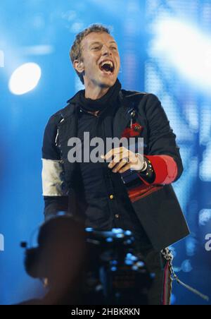 Chris Martin of Coldplay performs on stage at Wembley Stadium, North London. Stock Photo