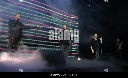 Nicky Byrne, Mark Feehily, Shane Filan and Kian Egan of Westlife performing during Capital FM's Jingle Bell Ball at the O2 Arena in London. Stock Photo