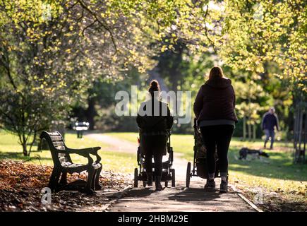 Two young mothers in Collett Park in Shepton Mallet, Somerset, UK Stock Photo