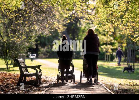Two young mothers in Collett Park in Shepton Mallet, Somerset, UK Stock Photo