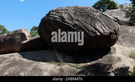Beautiful green evergreen landscape and large rocks. And blue sky. In the middle of nature. Stock Photo