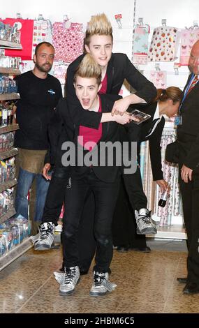 Jon and Edward Grimes aka Jedward sign new album at Tesco in Brent Park, London. Stock Photo