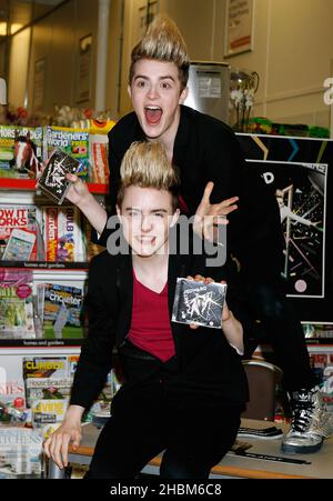 Jon and Edward Grimes aka Jedward sign new album at Tesco in Brent Park, London. Stock Photo