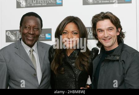 Naomie Harris , Oliver Litondo and Director Justin Chadwick attend the BFI London Film Festival 'The First Grader' Photo Call at the Vue Cinema, Leicester Square,London Stock Photo