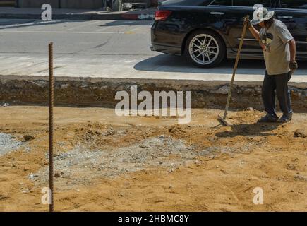 PATTAYA, THAILAND - Oct 24, 2019: PATTAYA,THAILAND - OCTOBER 24,2019:Beachroad This is a part of the construction site,where Thai workers modernized t Stock Photo