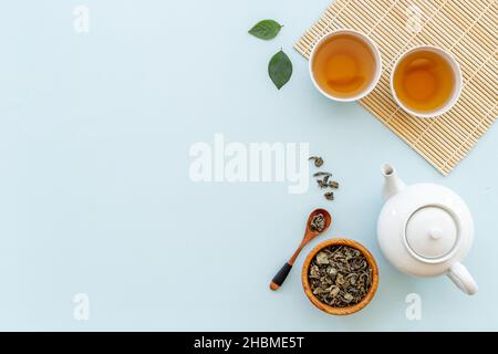 Asian tea set with white teapot and two cups, top view Stock Photo