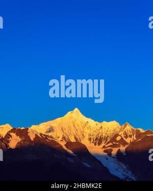 Meri Snow Mountain sunrise golden view China Stock Photo