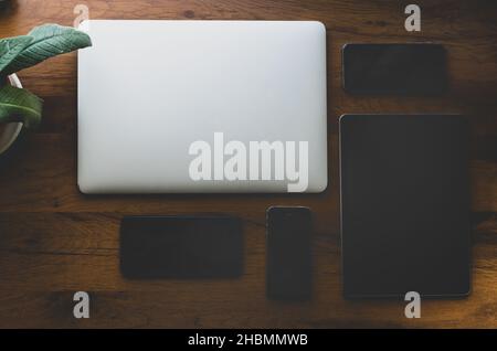 5 different size mobile technologies on the table Stock Photo