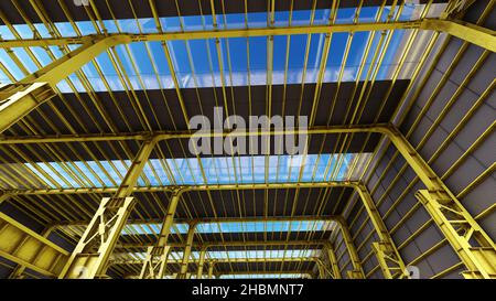Structure and yellow factory shed with details of steel cables and screws empty and without people Stock Photo