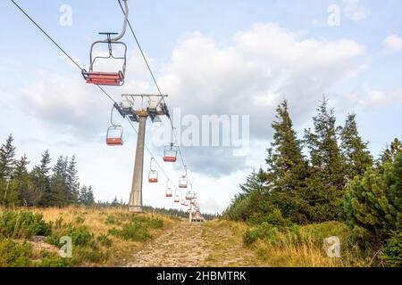 Chairlift in the Jeseniky mountains in the Czech republic to the Serak mountain peak Stock Photo