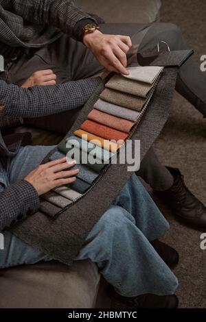 Two people studying swatches in furniture store Stock Photo