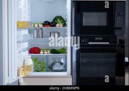 Picture of the fridge with food inside Stock Photo