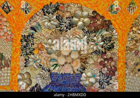 Part of the mural of beautiful mosaic multi coloured shells and tesserae in the Shell House in the Abbey Gardens on the island of Tresco in the Isles Stock Photo