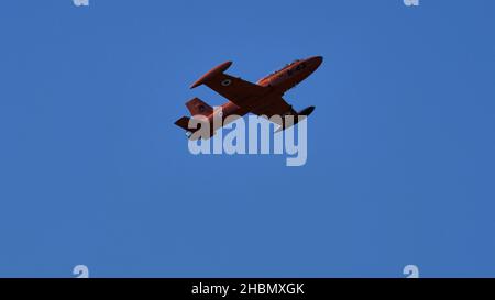 Rivolto del Friuli Italy SEPTEMBER, 17, 2021 Orang, high visibility, military jet plane in flight with completely blue sky background. Aermacchi MB-32 Stock Photo