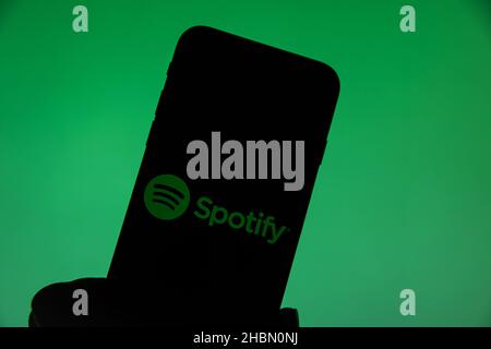 Rheinbach, Germany  20 December 2021,  The brand logo of the music streaming service 'Spotify' on the display of a smartphone Stock Photo