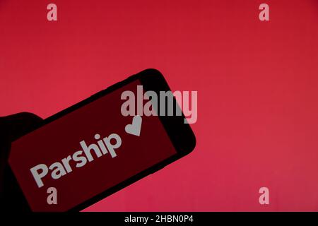 Rheinbach, Germany  20 December 2021,  The brand logo of the online dating agency 'Parship' on the display of a smartphone (focus on the brand logo) Stock Photo