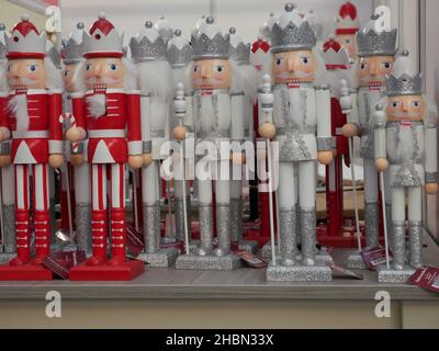Wooden nutcracker soldier Christmas decorations for sale on a market stall Stock Photo