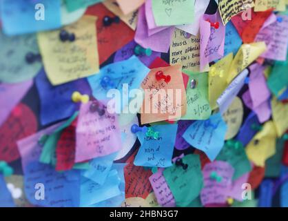 New York, United States. 20th Dec, 2021. People write notes on the confetti that will fall for New Year's Eve celebrations in Times Square in New York City on Monday, December 20, 2021. Photo by John Angelillo/UPI Credit: UPI/Alamy Live News
