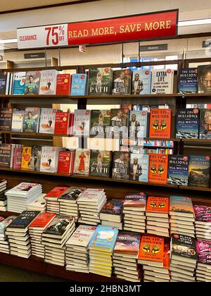 Display of books discounted to 75 percent off at a Barnes & Noble Booksellers location closing in December 2021. Stock Photo