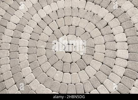 cobblestone pavement with circular pattern useful for background Stock Photo