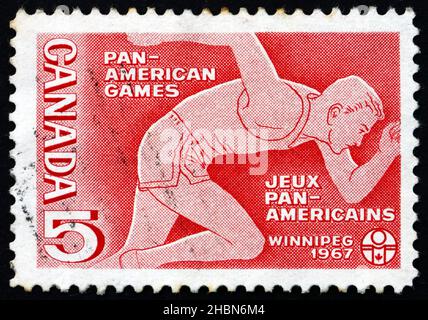 CANADA - CIRCA 1967: a stamp printed in the Canada shows Runner, Pan-American Games, Winnipeg, Manitoba, circa 1967 Stock Photo