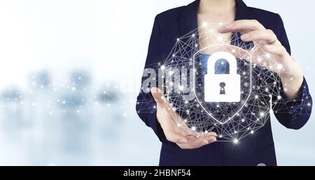 Data protection privacy concept. GDPR. Cyber security network. Two hand holding virtual holographic lock, padlock icon with light blurred background Stock Photo