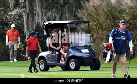 https://l450v.alamy.com/450v/2hbnfbe/orlando-united-states-19th-dec-2021-tiger-woods-drives-a-golf-cart-with-passengers-sam-woods-center-and-erica-herman-while-his-son-charlie-woods-walks-alongside-on-the-ninth-hole-during-the-final-round-of-the-pnc-championship-at-the-ritz-carlton-golf-club-grande-lakes-in-orlando-tiger-and-charlie-set-a-tournament-record-with-11-consecutive-birdies-on-sunday-shooting-a-15-under-par-57-and-finishing-second-in-the-36-hole-tournament-credit-sopa-images-limitedalamy-live-news-2hbnfbe.jpg