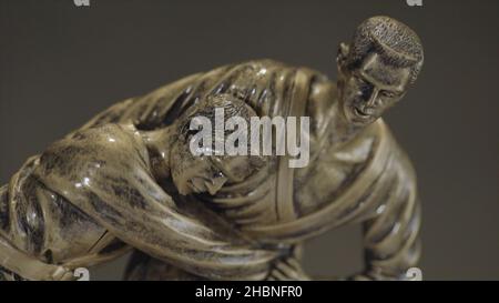 Bronze statuette of two men wrestling with each other close up. Champion wrestling Cup. Metal figurine on wrestling Stock Photo