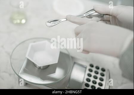 Young female scientist doing research in clinical lab. Close up Stock Photo