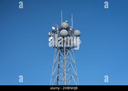 Washington, D.C. - Nov. 23, 2021: This communication tower on top of the ABC News building features parabolic microwave antennas with molded gray rado Stock Photo