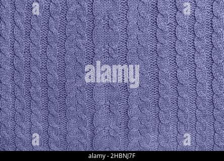 Violet very peri colored knitted wool background. Knitting pattern Stock Photo