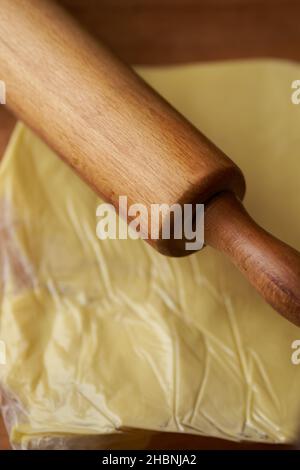 rolling pin on butter packed in transparent bag Stock Photo