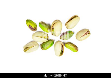 Top view of roasted salted pistachio nuts in nutshell isolated on white background. Stock Photo